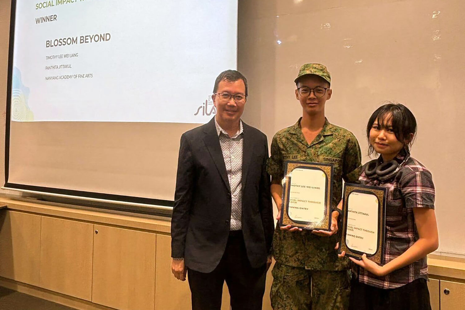 Recipients of the Social Impact Award: Timothy Lee Wei Liang, Pathita Jittakul.