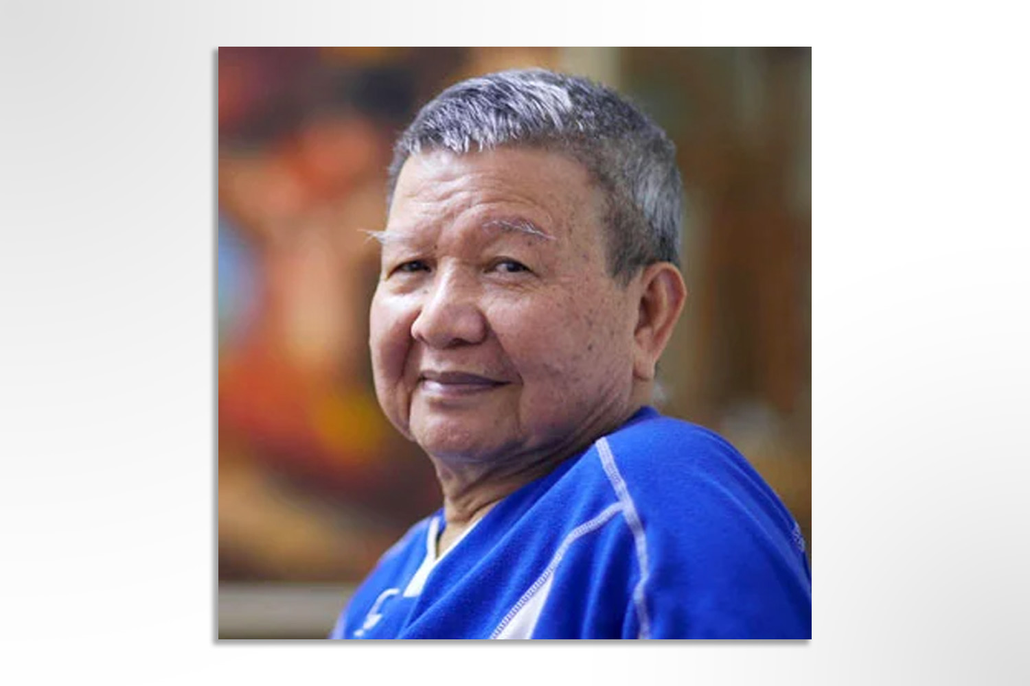 Siew Hock Meng in a golden-brown patterned shirt.