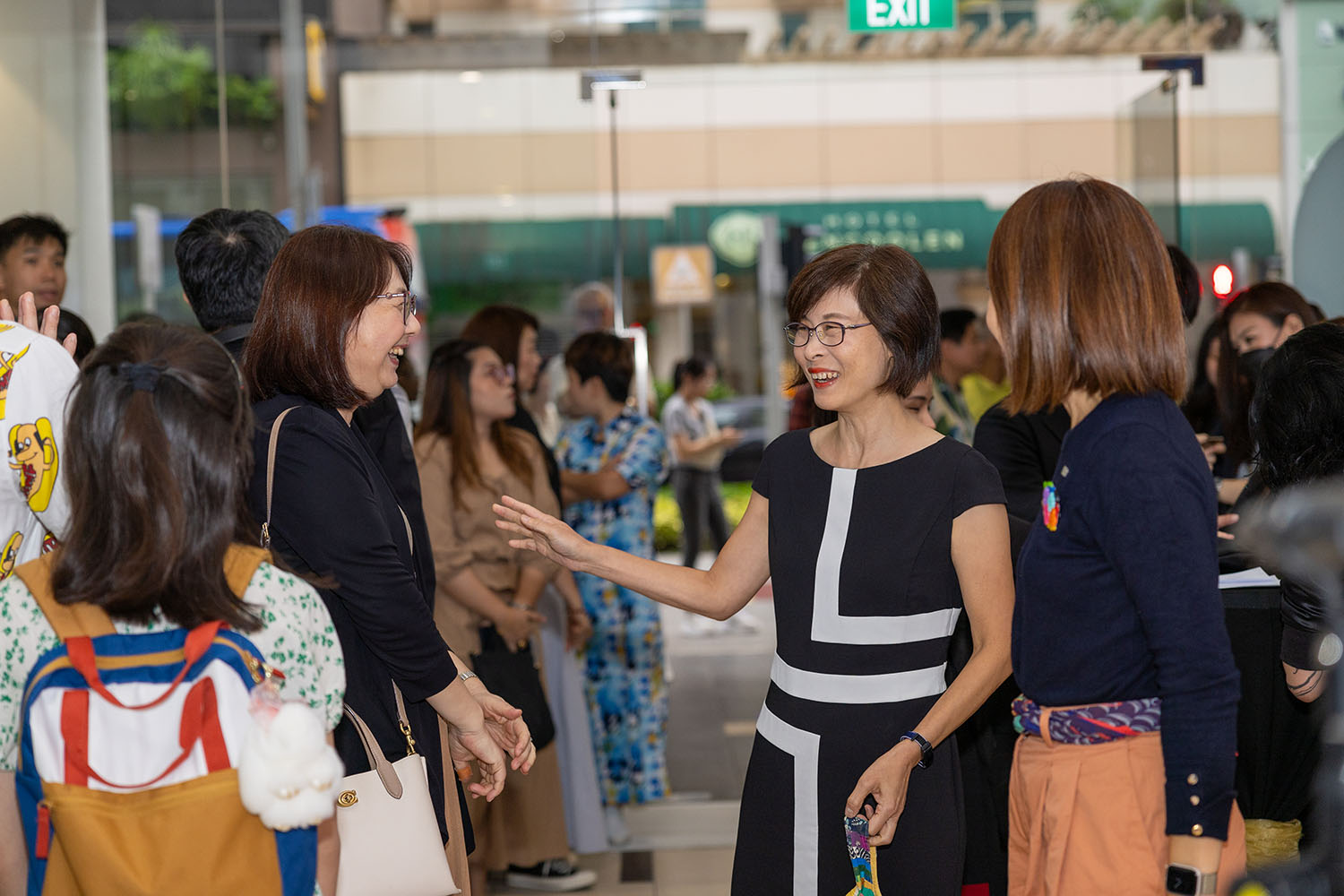 Various key personnel talking to each other at the Singapore Childrens Book Festival 2024.
