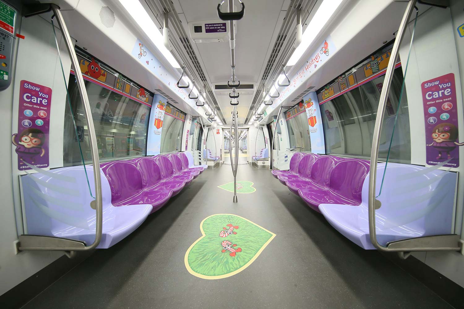 Different view of SBS Transit MRT interior decorated with Christmas festive illustrations, the train is empty.