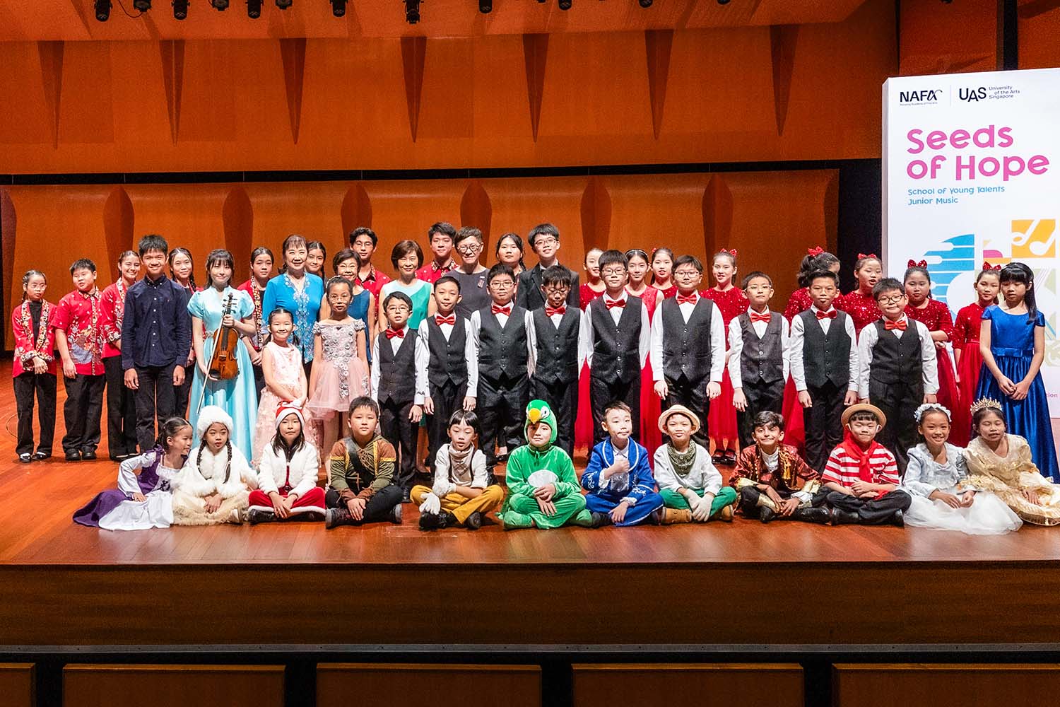 Various Junior Music performers on stage/theatre.