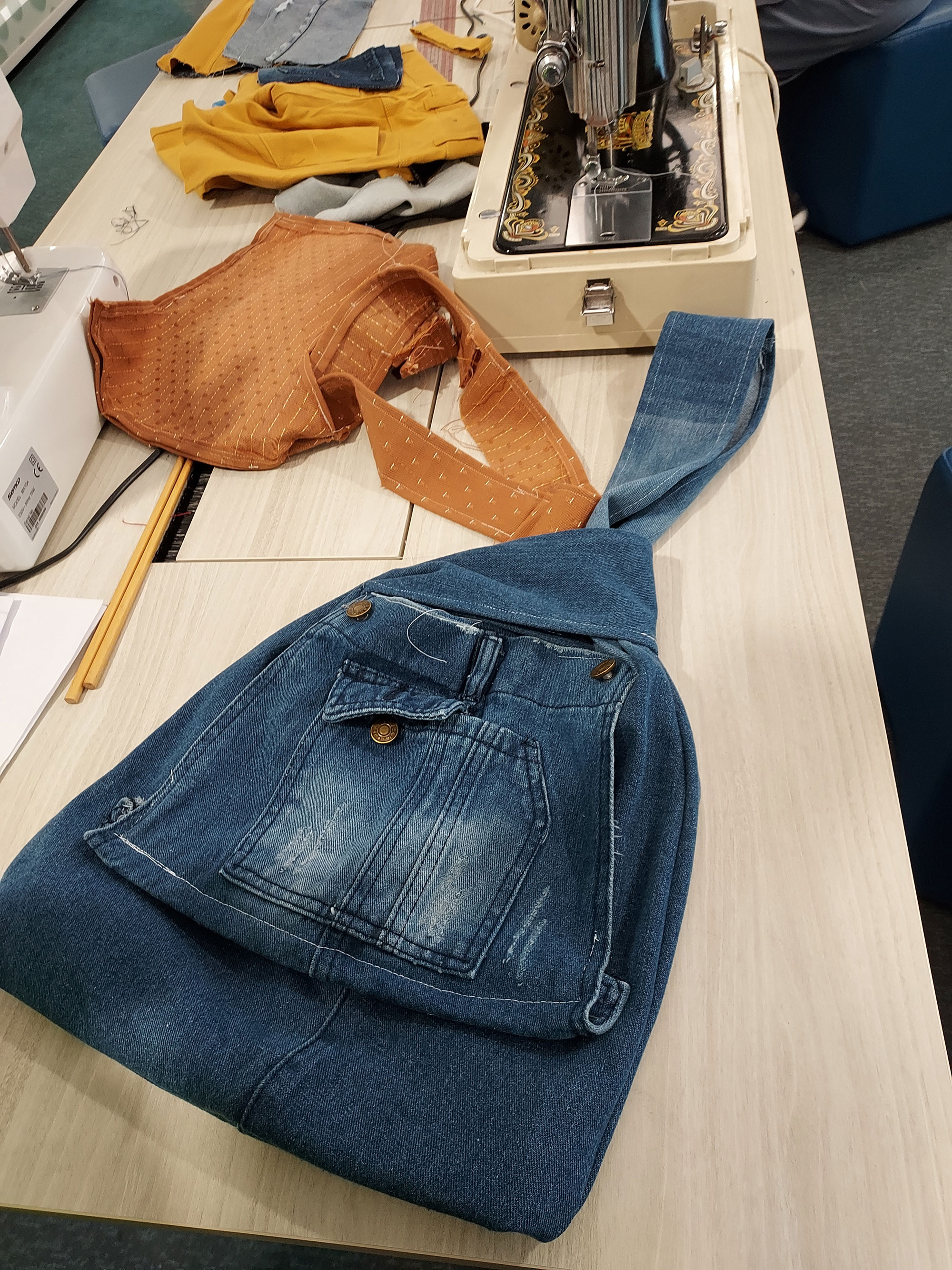 A bag made from a pair of denim jeans by a workshop participant
